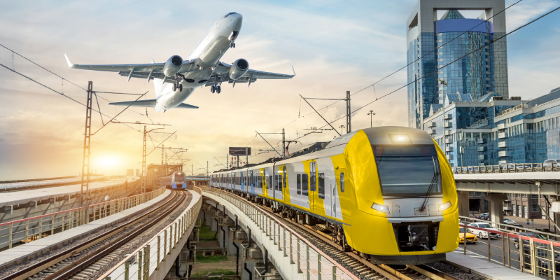 A plane and train in Zenitel colours and branding