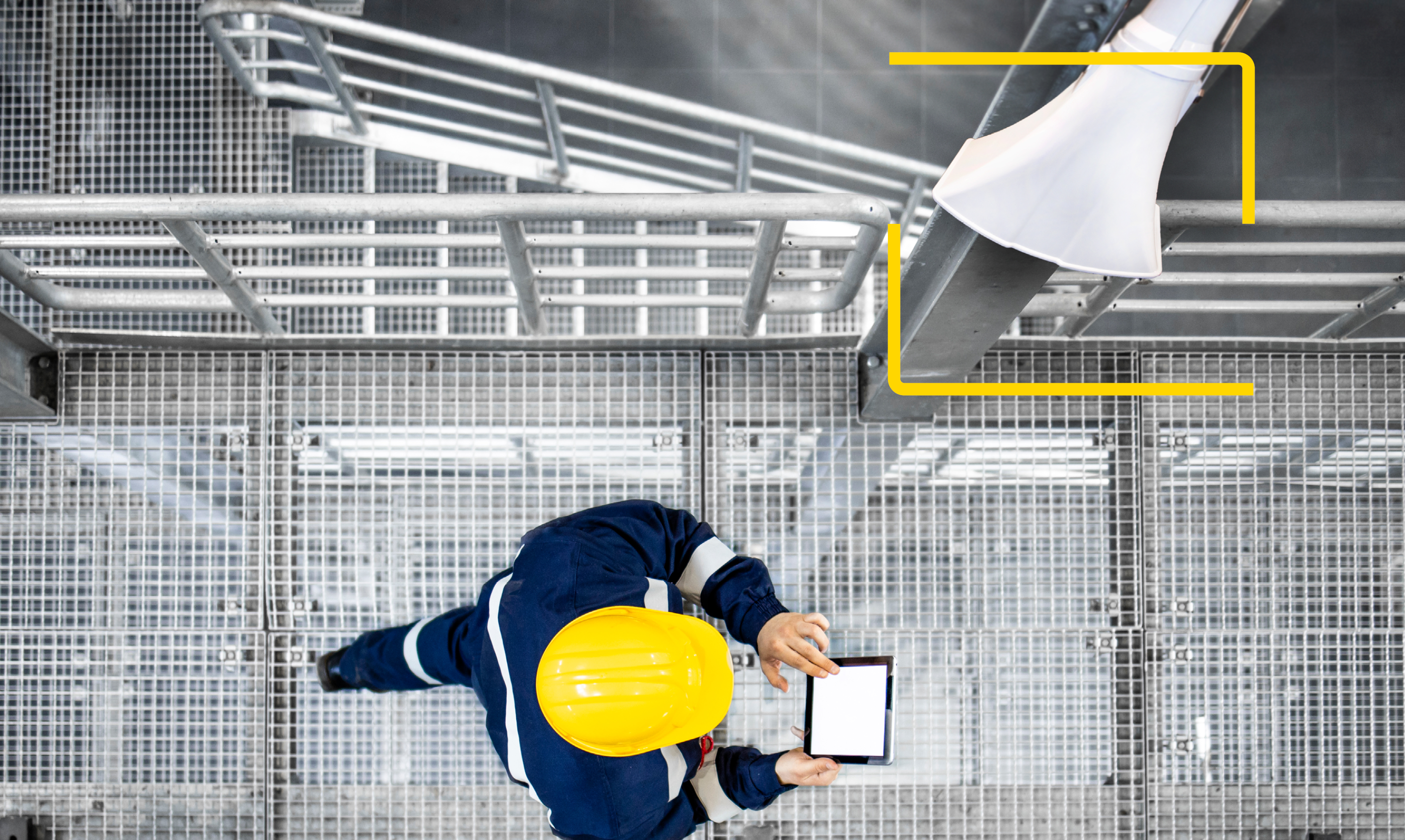 Worker in safety gear using a tablet on a metal platform, with a mounted Zenitel IP horn speaker highlighted.
