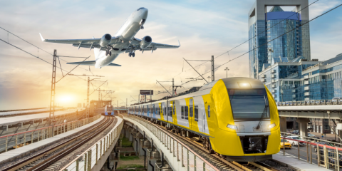 A plane and train in Zenitel colours and branding